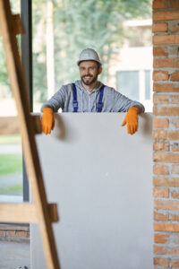 young male builder in hard hat smiling at camera 2021 09 04 10 05 13 utc